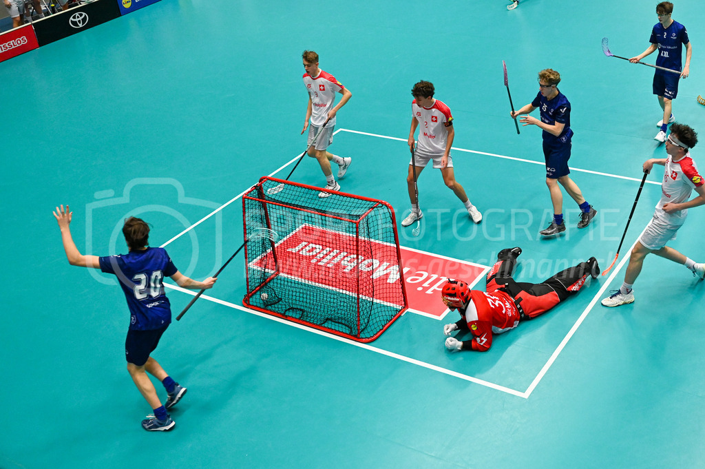Switzerland U19 vs Finland U19 - 3. February 2024 | Switzerland U19 vs Finland U19
U19 Men International Matches in Switzerland
GoEasy Arena, Siggenthal Station
Finland defender #20 Ilmo Leino scoring against Switzerland goalie #30 Ilja Brunner.
Credit: Markus Aeschimann | <a href="https://www.markus-aeschimann.ch">Sportfotografie Markus Aeschimann</a> | <a href="https://www.instagram.com/sportfotografie.aeschimann">@sportfotografie.aeschimann</a> - Realisiert mit Pictrs.com