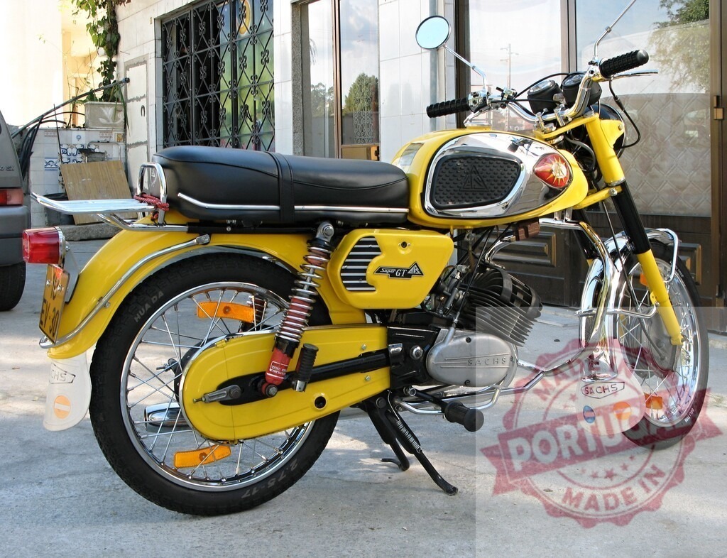 Yellow Motobi GT 125 motorcycle parking in urban setting | Classic yellow Motobi GT 125 motorcycle parked on a paved surface, showcasing its vintage design and Sachs engine - Realized with Pictrs.com