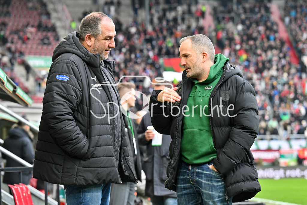 FC Augsburg - 1. FC Heidenheim | AUGSBURG, GERMANY - 15. FEBRUARY: im Gespräch Frank SCHMIDT Trainer 1. FC Heidenheim und Manuel BAUM Trainer FC Augsburg vor dem Bundesligamatch zwischen dem FC Augsburg und dem 1. FC Heidenheim am 22. Spieltag in der WWK-Arena / DFL REGULATIONS PROHIBIT ANY USE OF PHOTOGRAPHS AS IMAGE SEQUENCES AND/OR QUASI-VIDEO