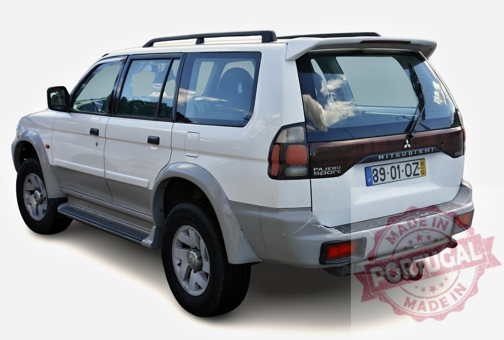 White Mitsubishi Pajero Sport showing its rear side | Rear view of a white Mitsubishi Pajero Sport parked, highlighting its design and features - Realized with Pictrs.com