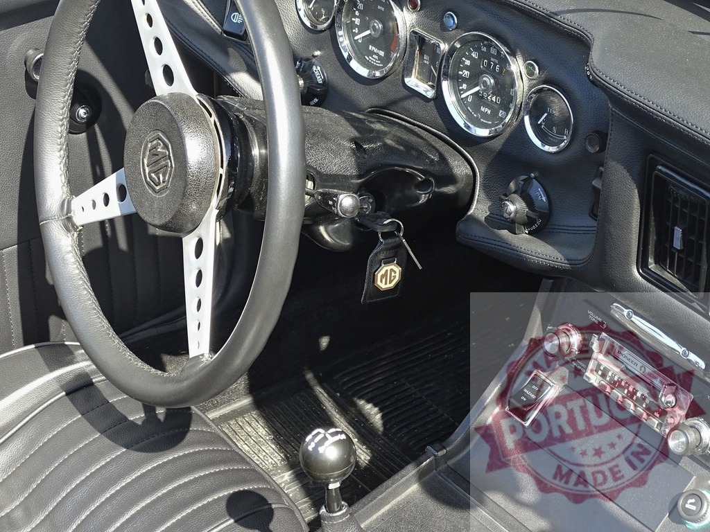 MG vintage car interior with steering wheel and dashboard | MG MGB classic roadster interior detailing the dashboard, steering wheel, and gear shift - Realized with Pictrs.com