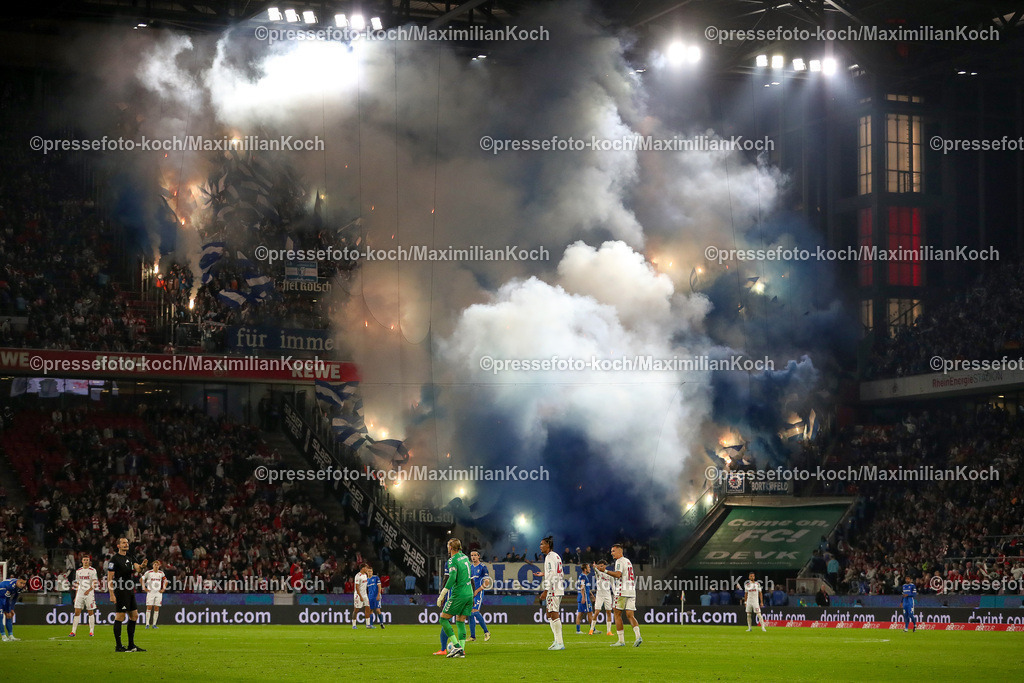 Koe14092402144 | 14.09.2024, 2. Fußball Bundesliga, 1. FC Köln - 1. FC Magdeburg, RheinEnergieSTADION, Saison 2024 2025: Ultras im Magdeburger Gästeblock zünden bengalisches Feuer Feuerwerkskörper Bengalos Blinker Rauchtöpfe Fans Zuschauer BesucherDFB regulations prohibit any use of photographs as image sequences and or quasi-video.
