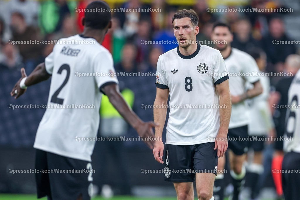 DFB23032502186 | 23.03.2025, Fußball, Viertelfinale UEFA Nations League, Deutschland - Italien, Signal Iduna Park, Saison 2024 2025: Antonio Rüdiger (GER #02) gestikulierend neben Leon Goretzka (GER #08) DFB regulations prohibit any use of photographs as image sequences and or quasi-video.