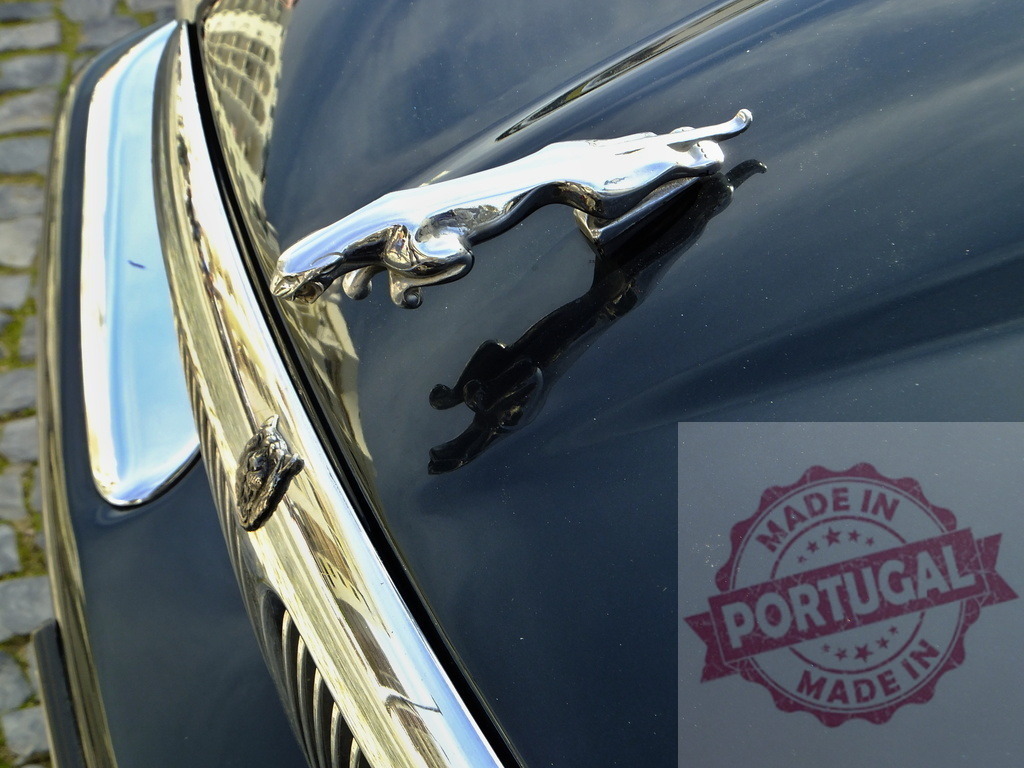 Jaguar hood ornament reflecting on polished hood of luxury car | Chrome Jaguar leaper hood ornament is reflecting on the polished hood of a luxury Jaguar car - Realized with Pictrs.com