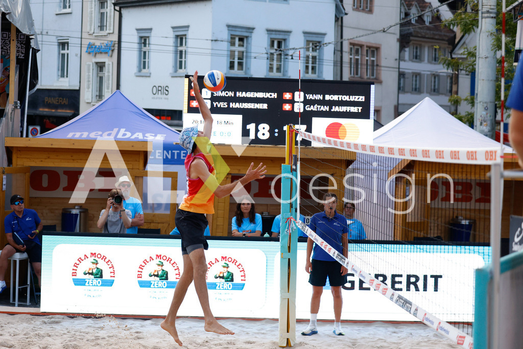 Obi BeachTour 2026 - Basel | BASEL, SWITZERLAND - JULY 17: SIMON HAGENBUCH (SUI) attack / spike during the Obi BeachTour 2026 match between HAGENBUCH / HAUSSENER (SUI) and BORTOLUZZI / JAUFFRET (SUI) at Barfüsserplatz on July 17, 2026 in Basel, Switzerland. - Realisiert mit Pictrs.com