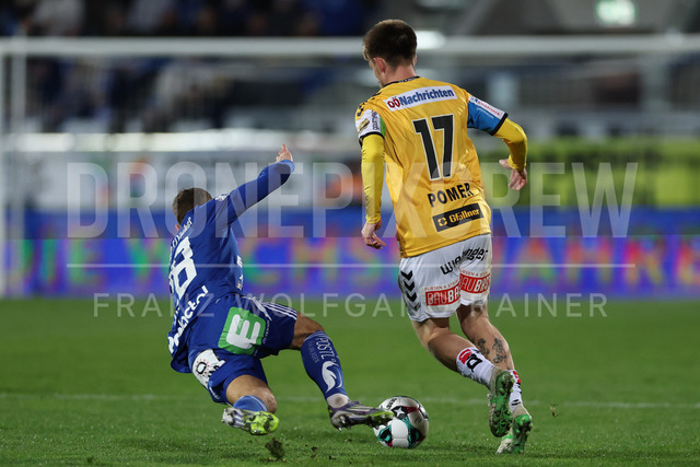 TSV Egger Glas Hartberg vs SV Oberbank Ried – Austrian Bundesliga Match | The image shows Juergen Heil (Hartberg) and Philipp Pomer (Ried) by fight for the ball, at the Bundesliga match TSV Hartberg vs SV Ried at Profertil Arena Hartberg. 22.11.2025