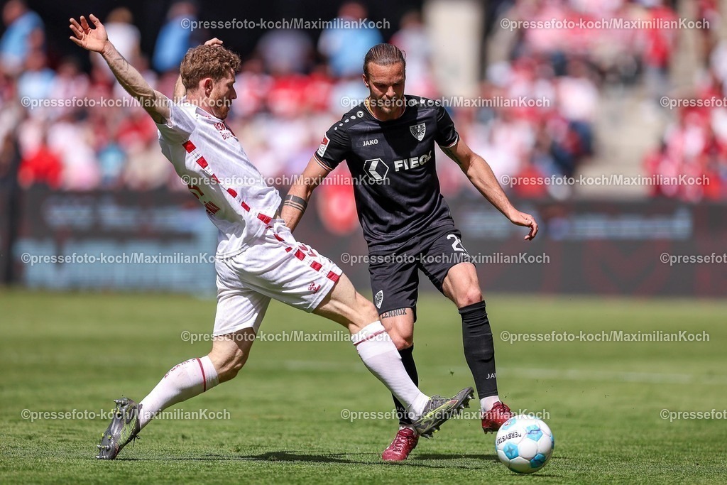 1FC20042501062 | 20.04.2025, Fußball, 1. FC Köln - Preußen Münster, 2.. Fußball Bundesliga, 30. Spieltag, RheinEnergie-STADION, Saison 2024 2025: Florian Kainz (FC Koeln #11) im Zweikampf gegen Mikkel Kirkeskov (Preussen Muenster #02) DFB regulations prohibit any use of photographs as image sequences and or quasi-video.