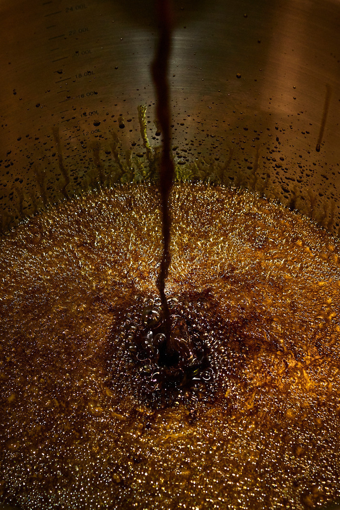 Die Ölmühle | Markt Allhau, Austria - February 09, 2018: Die Ölmühle; aus der hydraulischen Presse frisch auslaufendes Kürbiskernöl. - Realisiert mit Pictrs.com