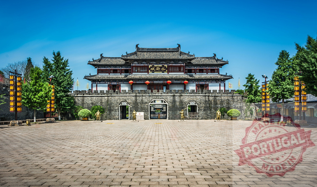 Ancient chinese city wall gate historical architecture | Ancient fortress gate standing under a clear blue sky, showing traditional Chinese architecture and history - Realized with Pictrs.com