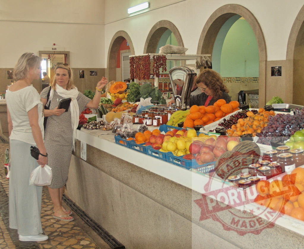 Visitors shopping for fresh produce at Mercado dos Lavradores | Women buying fruits and vegetables at a traditional indoor market stall - Realized with Pictrs.com