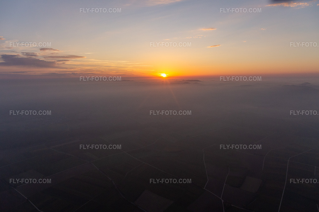 Aerial view: Sunset over the Northern Vosges and the Palatinate Forest in Wissembourg in the state Bas-Rhin, France. – Photo: IMG_144094.jpg taken on 11/09/2024 by Werner Riehm/FLY-FOTO.com – Resolution of the original: 5472 x 3648 px
