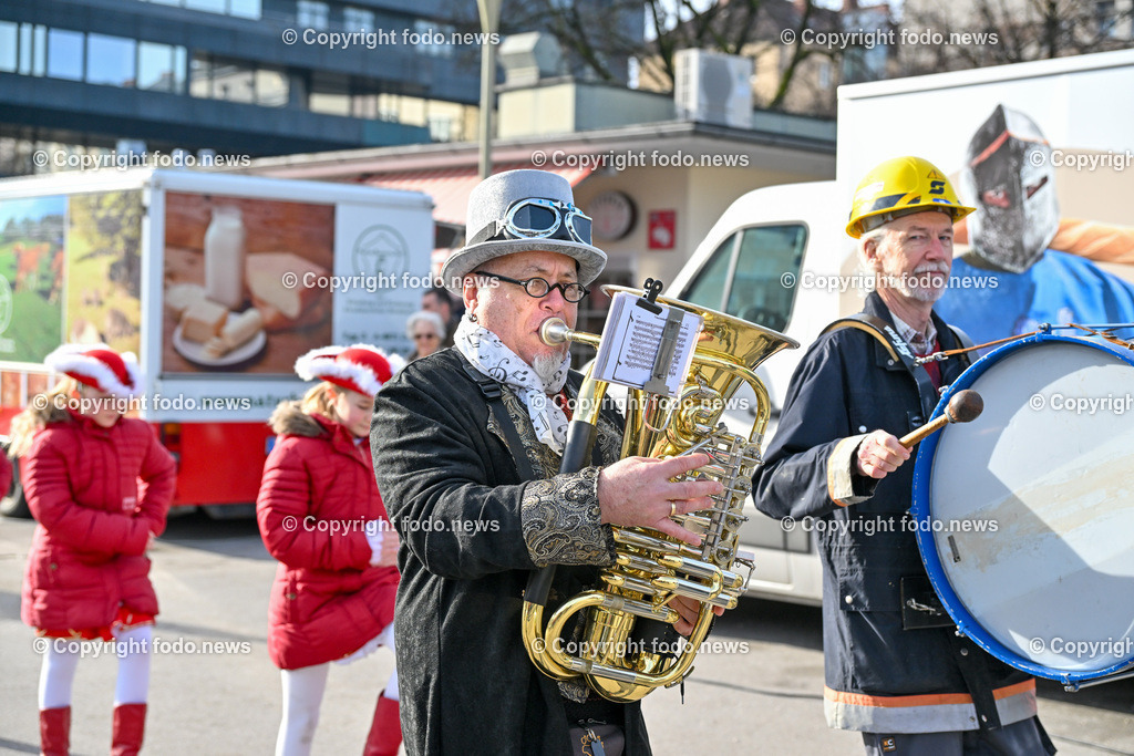 Suedbahnhofmarkt Linz_ Faschingsumzug 2024_ 10.02.2024-4 | 10.02.2024, Linz, AUT, Suedbahnhofmarkt, Faschingsumzug 2024, im Bild Ebelsberger Faschingsgilde, Umzug, Musik, Masken, maskiert, Krapfen, Verkleidungen, Prinzenpaar