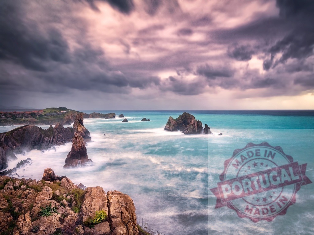 Stormy sky over a dramatic rugged turquoise coast | Rugged coastline with rock formations and crashing waves under a moody sky - Realized with Pictrs.com