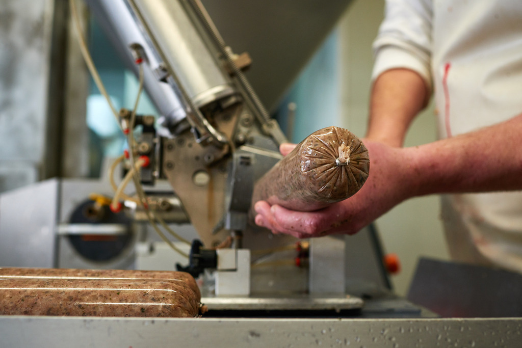 Fleischerei Dormayer | Langenzersdorf, Austria - February 12, 2019: Fleischerei Dormayer; Abfüllen der Wurst an der Wurstfüllmaschine. - Realisiert mit Pictrs.com