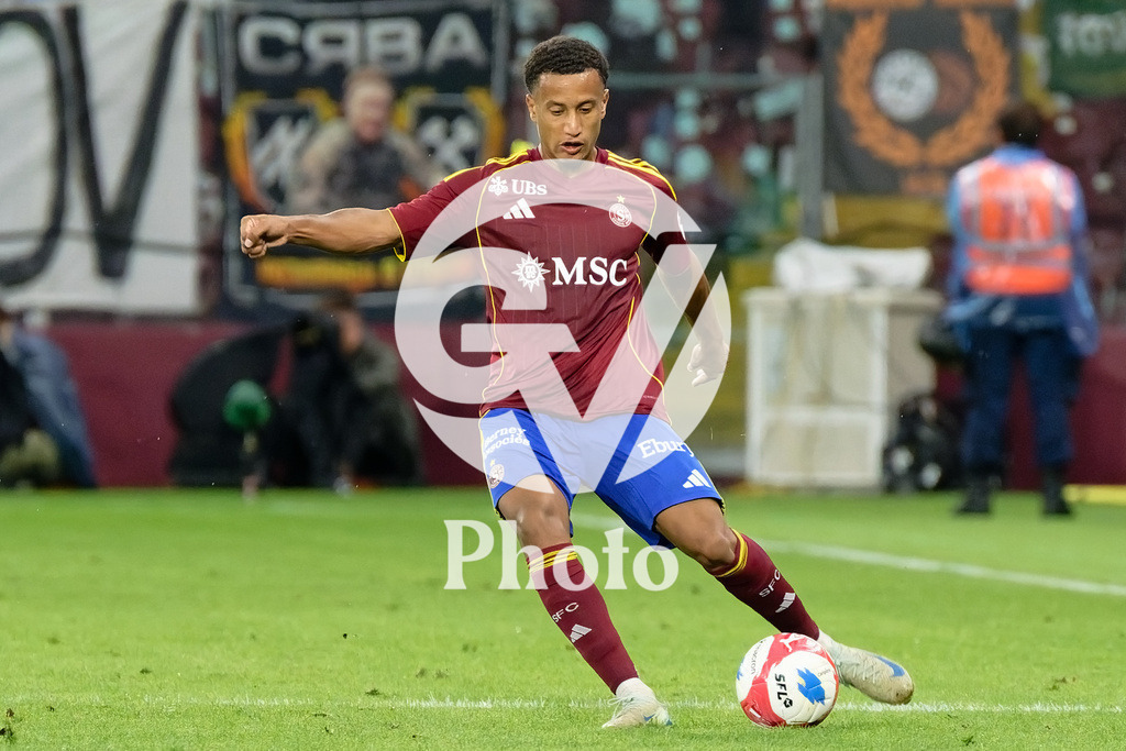 UEFA Conference League Play-offs 2nd leg - Servette FC v FC Shakhtar Donetsk | Lilian Njoh (14 Servette FC) shoots the ball (action)  during the UEFA Conference League Play-offs 2nd leg match between Servette FC and FC Shakhtar Donetsk at Stade de Geneve in Geneva, Switzerland