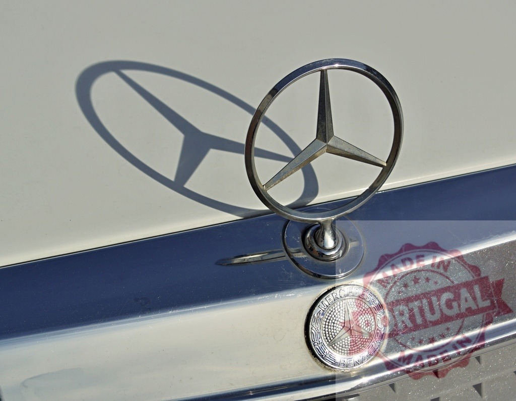 Mercedes-Benz logo casting shadow on car hood | Mercedes-Benz emblem standing on a car hood, casting a distinctive shadow - Realized with Pictrs.com