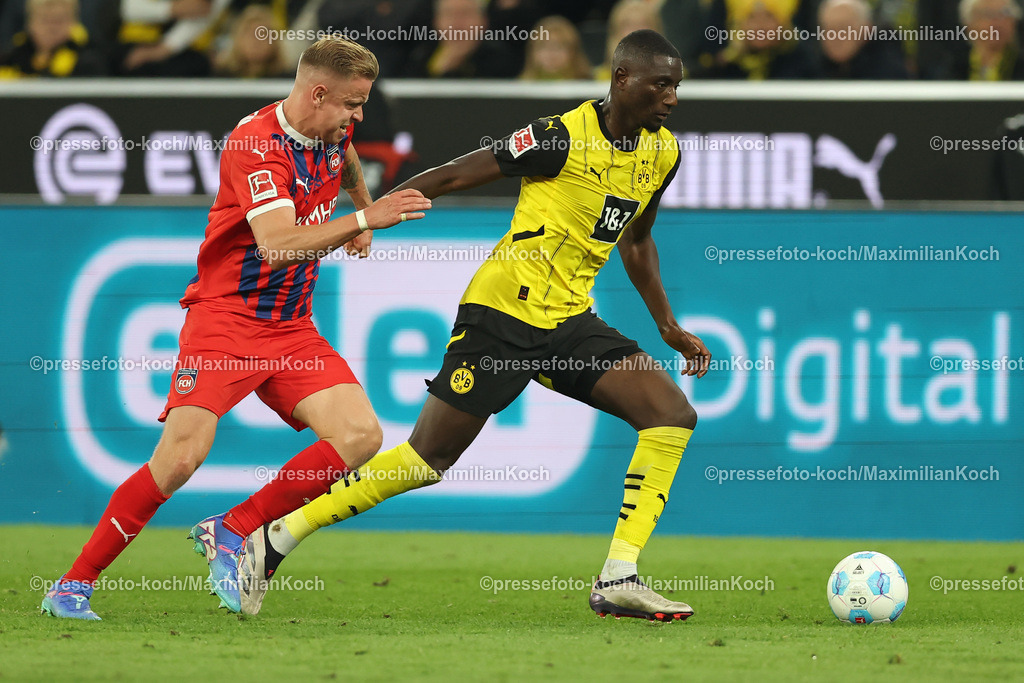 BVB13092402228 | 13.09.2024, 1. Fußball Bundesliga, Borussia Dortmund - 1. FC Heidenheim 1846, Signal Iduna Park, Saison 2024 2025: Lennard Maloney (Heidenheim #33) gegen Serhou Guirassy (BVB #9)DFB regulations prohibit any use of photographs as image sequences and or quasi-video.