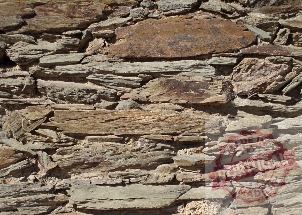 Background of flat stones forming a wall showing different colors and textures | Wall made with flat stones creating a background with different textures and colors - Realized with Pictrs.com