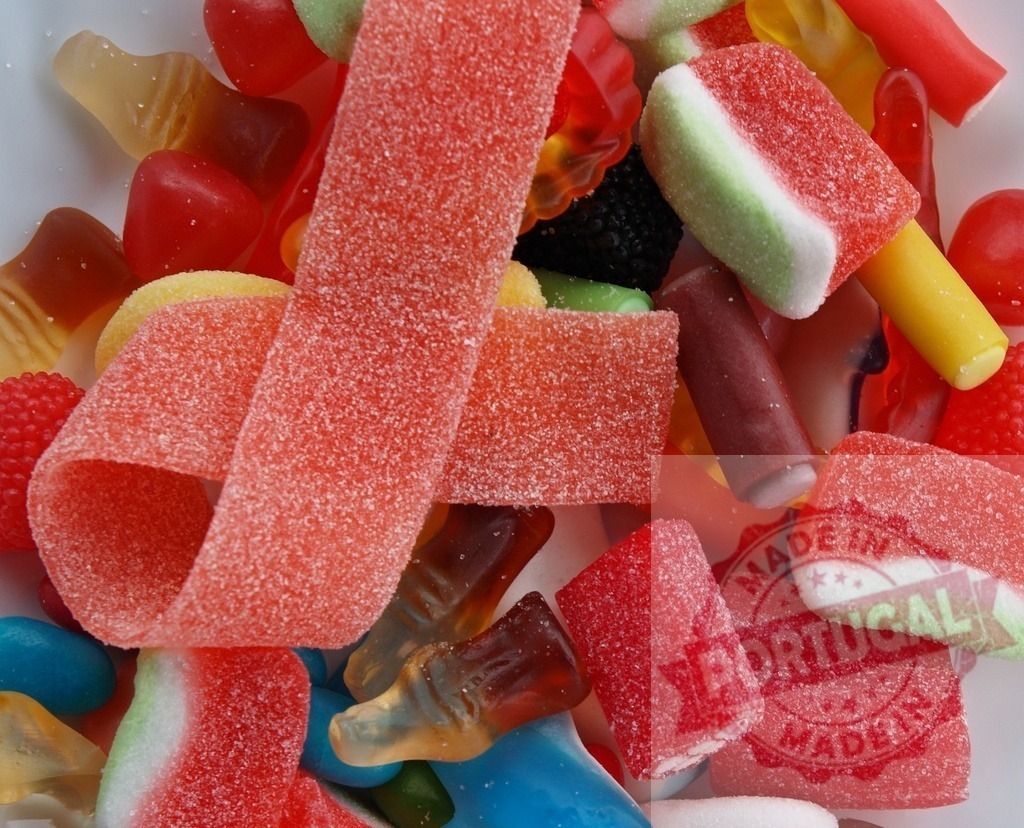Assorted colorful gummy candies and sugary treats | Assorted colorful gummy candies and sugary treats creating a vibrant background - Realized with Pictrs.com