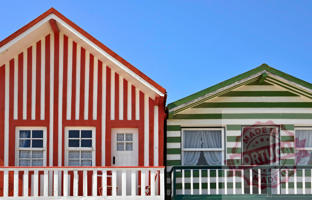 Costa Nova traditional striped houses in Aveiro, Portugal | Colorful striped houses creating a vibrant summer vacation scene under a clear blue sky - Realized with Pictrs.com
