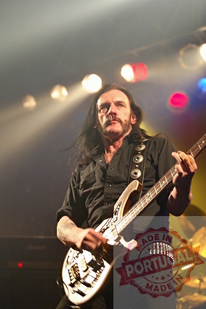 Lemmy Kilmister from Motörhead playing bass guitar during live rock concert | Lemmy Kilmister from Motörhead energetically playing bass guitar on stage during live rock concert - Realized with Pictrs.com