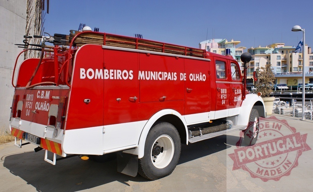 Bombeiros Municipais de Olhão fire truck Portugal | Red fire truck from Bombeiros Municipais de Olhão parked by a marina, Portugal - Realized with Pictrs.com