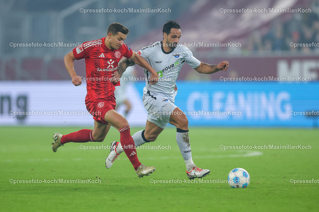 Due0911240109602146 | 09.11.2024, Fußball, Fortuna Düsseldorf - SC Paderborn 07, 2. Bundesliga, Merkur Spiel-Arena, Saison 2024 2025: Tim Oberdorf (Fortuna Düsseldorf #15) gegen Adriano Grimaldi (Paderborn #39) DFB regulations prohibit any use of photographs as image sequences and or quasi-video.