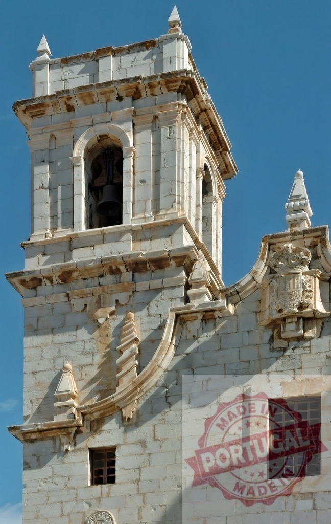 Church bell tower with baroque architectural details in stone | Historic architectural details of an old church bell tower structured with stone and bells - Realized with Pictrs.com