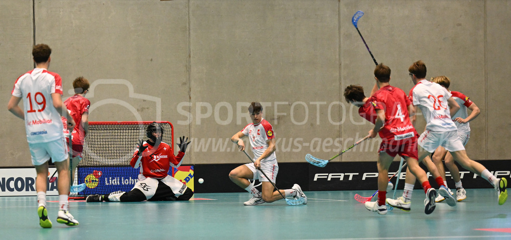 Switzerland B U19 vs Switzerland U19 - 4. February 2024 | Switzerland B U19 vs Switzerland U19
U19 Men International Matches in Switzerland
GoEasy Arena, Siggenthal Station
Switzerland forward #16 Dario Bürgler scores against Switzerland goalie #1 Eric Kunz.
Credit: Markus Aeschimann | <a href="https://www.markus-aeschimann.ch">Sportfotografie Markus Aeschimann</a> | <a href="https://www.instagram.com/sportfotografie.aeschimann">@sportfotografie.aeschimann</a> - Realisiert mit Pictrs.com