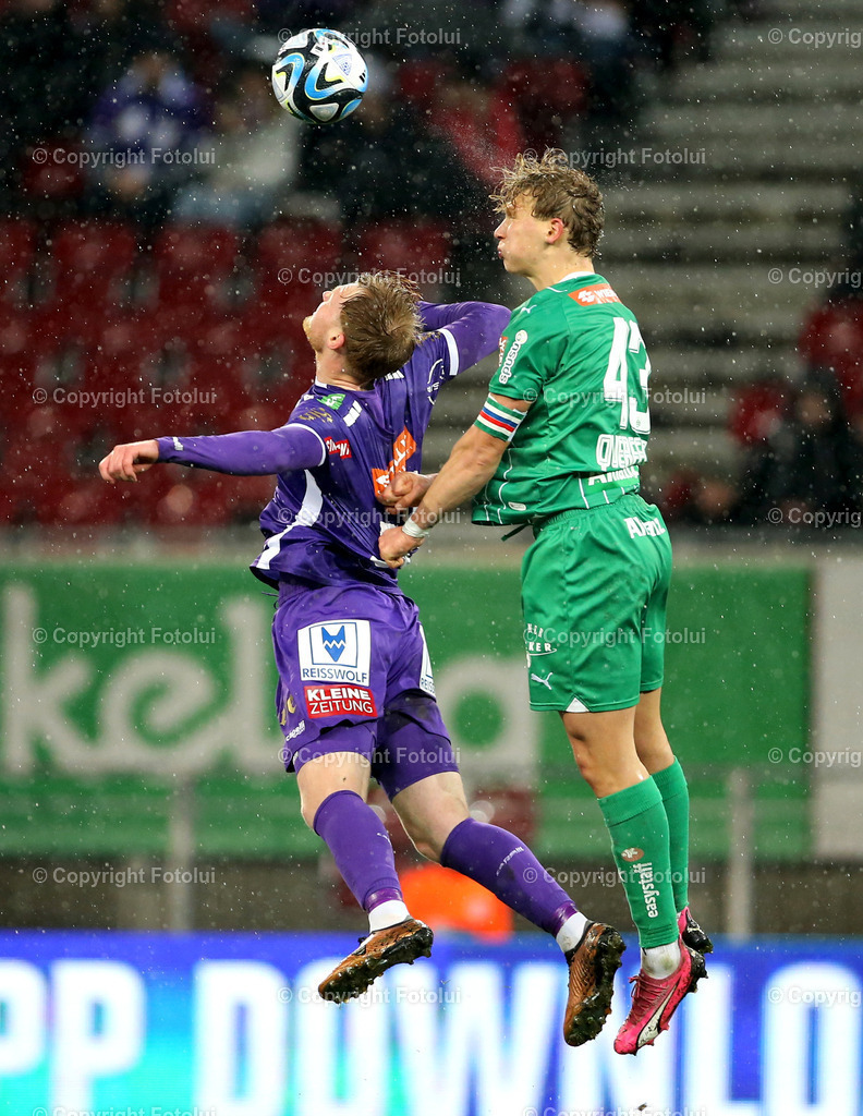 A_LUI_10032024_20 | SPORT,FUSSBALL, ADMIRAL BUNDESLIGA AUSTRIA KLAGENFURT-SK RAPID WIEN 10.03.2024 IM BILD: JONAS ARWEILER (KLAGENFURT) UND LEOPOLD QUERFELD (RAPID WIEN) FOTO:FOTOLUI/MW