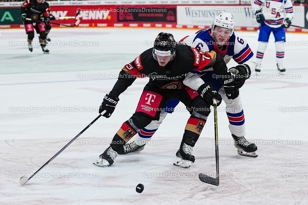 xYDR04052501026 | 04.05.2025, xydrx, Eishockey WM Qualifikation, Deutschland - USA, PSD Bank Dome: Lukas Reichel (Deutsche Eishockey Nationalmannschaft #73) im Zweikampf gegen Mason Lohrei (USA Eishockey Nationalmannschaft #6)
