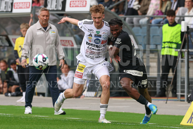 SK Puntigamer Sturm Graz vs TSV Egger Glas Hartberg – Championship Group    | Graz, Austria, 12.Apr.26 - SOCCER - ADMIRAL Bundesliga, SK Puntigamer Sturm Graz vs TSV Egger Glas Hartberg. The image shows Konstantin Schopp (Hartberg) and Seedy Jatta (STU).    