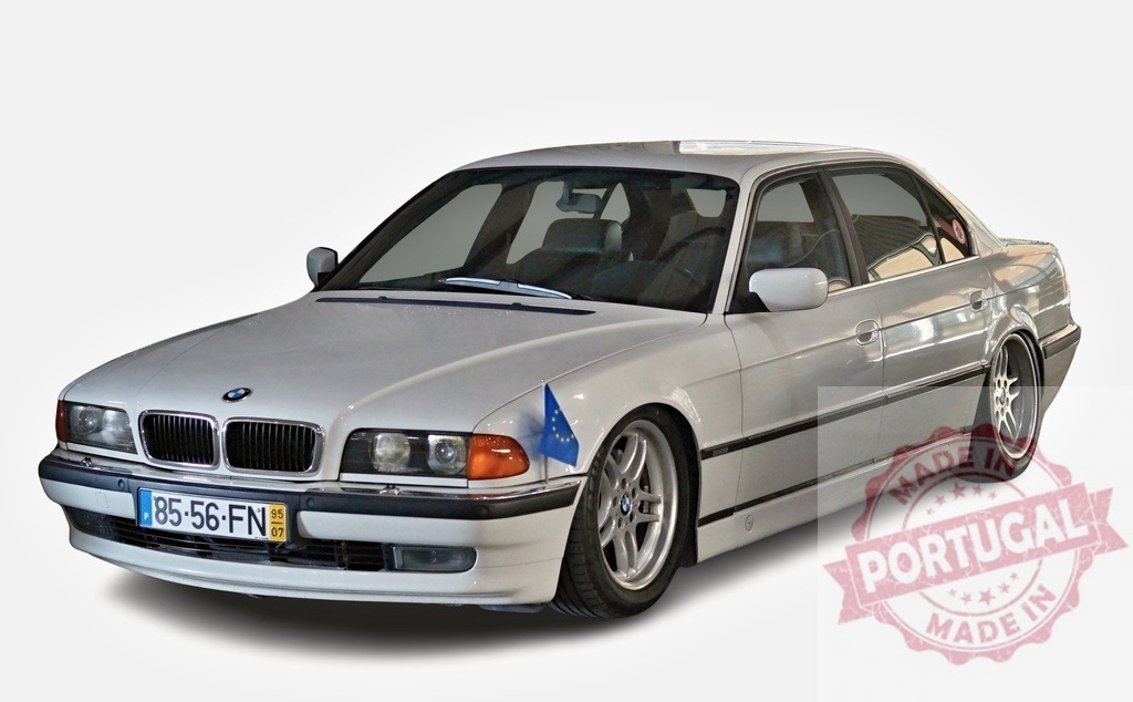 BMW E38 7 Series executive sedan with European flag | White BMW E38 sedan displaying European Union flag on isolated white background - Realized with Pictrs.com