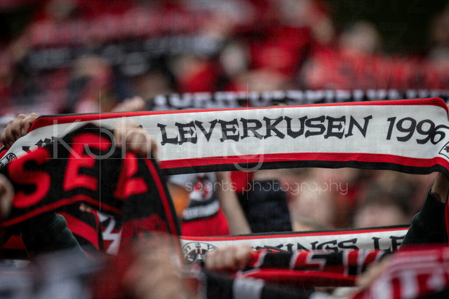 German Bundesliga, Bayer 04 Leverkusen vs. VfL Wolfsburg, 04.04.2026 | LEVERKUSEN, GERMANY - APRIL 4, 2026 :  Fans from Leverkusen hold their scarves aloft during the club anthem during the German Bundesliga match on gameday 28 between Bayer 04 Leverkusen vs. VfL Wolfsburg at BayArena on April 4, 2026 in Leverkusen, Germany. DFL REGULATIONS PROHIBIT ANY USE OF PHOTOGRAPHS AS IMAGE SEQUENCES AND/OR QUASI-VIDEO.