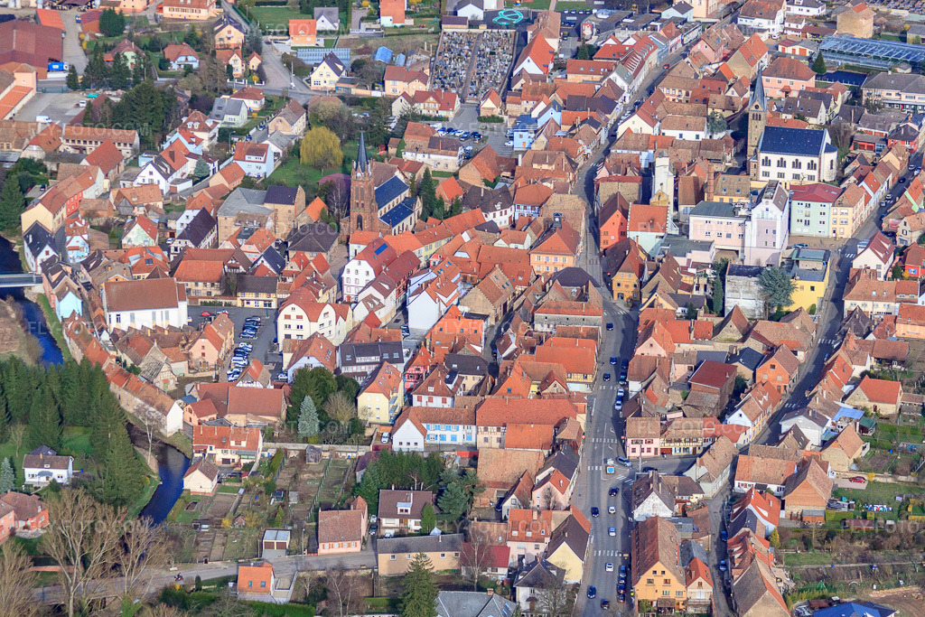 Aerial view: Rue du Dr. Albert Schweitzer with Eglise Saints Pierre et Paul de Pfaffenhoffen and Église protestante de Pfaffenhoffen-Niedermodern in Val-de-Moder in the state Bas-Rhin, France.Photo: IMG_38634.jpg taken on 03/20/2011 by Werner Riehm/FLY-FOTO.comResolution of the original: 4752 x 3168 px