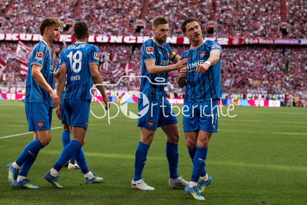 FC Bayern München - 1. FC Heidenheim | MUNICH, GERMANY - 02. MAI: Jubel der Gäste nach dem Treffer zum 0-1 durch Budu ZIVZIVADZE (1. FC Heidenheim 11) während dem Bundesligamatch zwischen dem FC Bayern München und dem 1. FC Heidenheim am 32. Spieltag in der Allianz Arena / DFL REGULATIONS PROHIBIT ANY USE OF PHOTOGRAPHS AS IMAGE SEQUENCES AND/OR QUASI-VIDEO