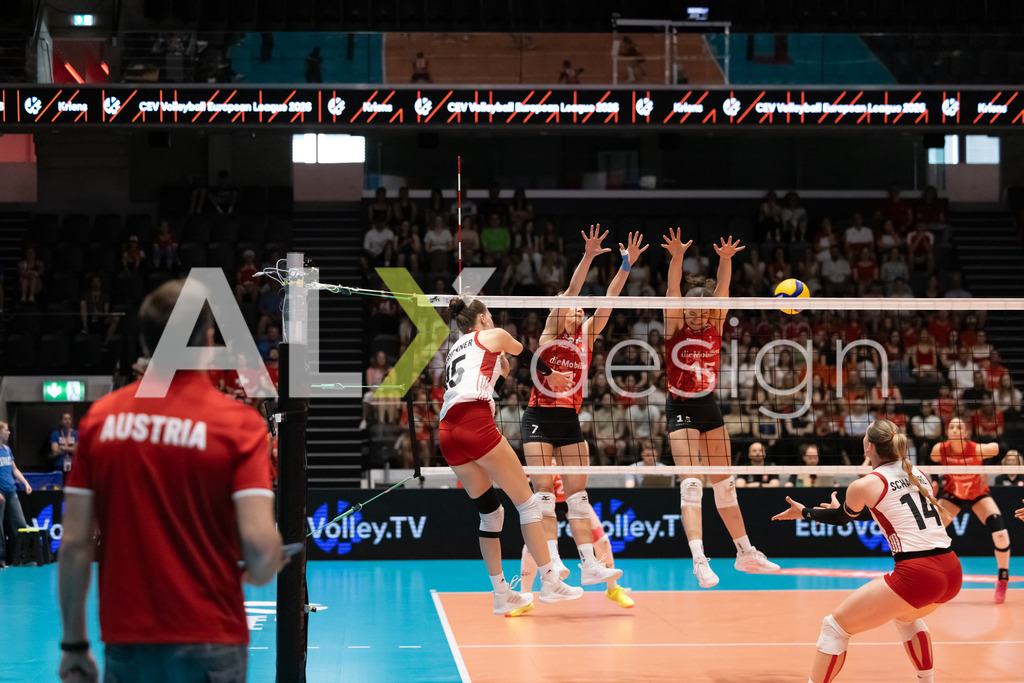 Austria v Switzerland - CEV European League Women | KRIENS, SWITZERLAND - JUNE 14: MARIE KRISTIN BRUCKNER of Austria attack / spike against ALIX DE MICHELI of Switzerland and MÉLINE PIERRET of Switzerland during the CEV European League match between Austria and Switzerland at Pilatus Arena on June 14, 2026 in Kriens, Switzerland. - Realisiert mit Pictrs.com