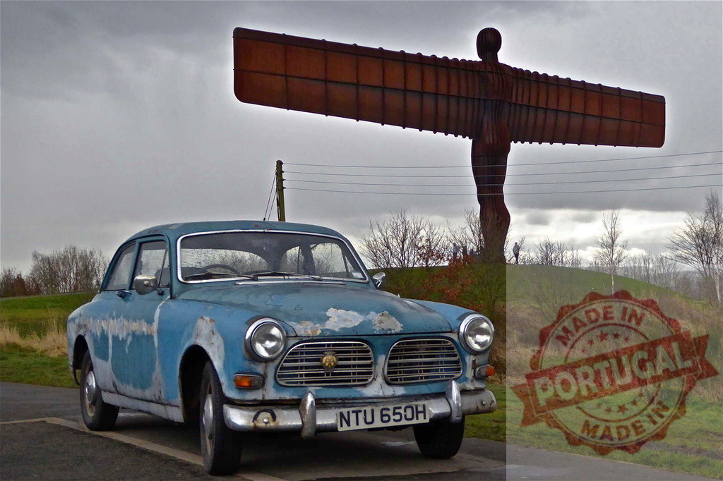Rusty vintage Volvo Amazon parked near Angel of the North in Gateshead, England | Old rusty light blue Volvo Amazon parked on a cloudy day near the Angel of the North, a contemporary steel sculpture by Antony Gormley - Realized with Pictrs.com
