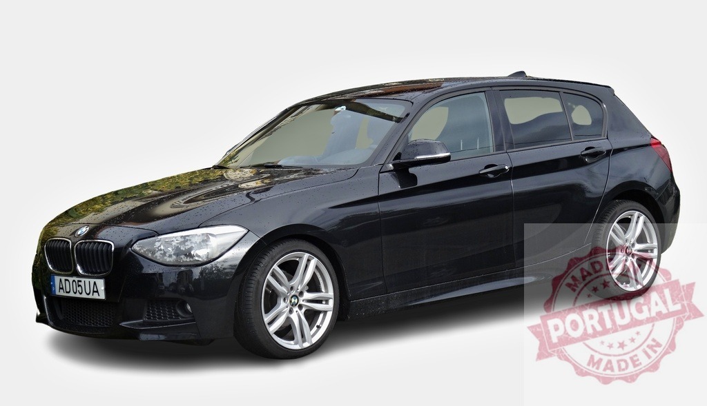 Shiny black BMW 1 Series is parked on white background | Studio shot of a modern black BMW 1 Series on a white background - Realisiert mit Pictrs.com