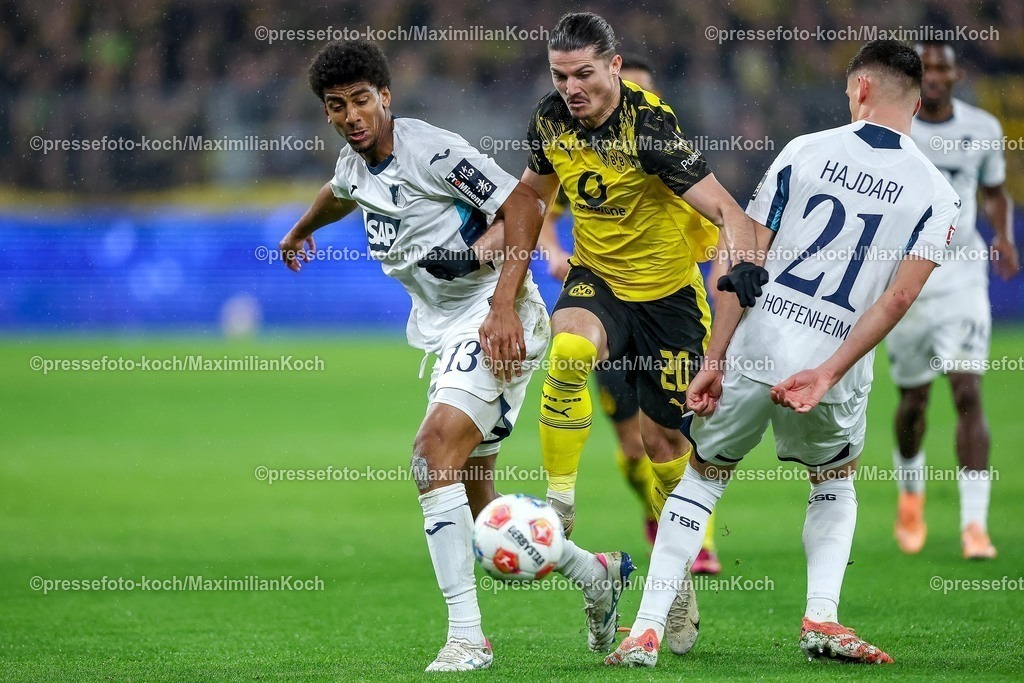 BVB07122501015 | 07.12.2025, Fußball, Borussia Dortmund - TSG 1899 Hoffenheimt, 1. Fußball Bundesliga, 13. Spieltag, Signal Iduna Park, Saison 2025 2026: Marcel Sabitzer&nbsp;(BVB #20) im Zweikampf gegen  Bernardo&nbsp;(TSG Hoffenheim #13) Albian Hajdari&nbsp;(TSG Hoffenheim #21)  DFB regulations prohibit any use of photographs as image sequences and or quasi-video.
