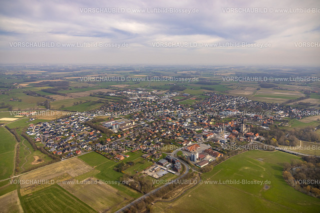 Lippetal240307073 | Luftbild, Wohngebiet Ortsansicht Ortsteil Herzfeld, vorne Lippborger Straße und Kesseler Straße mit Raiffeisengelände Vital eG und CT Agro GmbH Landmaschinenhändler, Lippetal, Herzfeld, Nordrhein-Westfalen, Deutschland