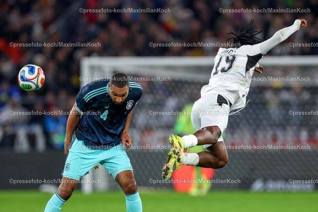 DFB30032600043 | 30.03.2026, Fußball, Länderspiel, Deutschland - Ghana, MHP-Arena (Stuttgart), Saison 2025 2026: Jonathan Tah (GER #04) im Zweikampf gegen  Prince Kwabena Adu (Ghana #19)  DFB regulations prohibit any use of photographs as image sequences and or quasi-video.