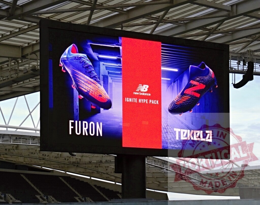New Balance advertisement for Furon and Tekela football boots | New Balance boots for the Ignite Hype Pack displaying on a stadium digital screen - Realisiert mit Pictrs.com