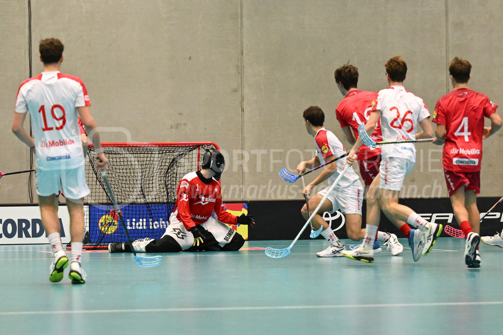 Switzerland B U19 vs Switzerland U19 - 4. February 2024 | Switzerland B U19 vs Switzerland U19
U19 Men International Matches in Switzerland
GoEasy Arena, Siggenthal Station
Switzerland forward #16 Dario Bürgler scores against Switzerland goalie #1 Eric Kunz.
Credit: Markus Aeschimann | <a href="https://www.markus-aeschimann.ch">Sportfotografie Markus Aeschimann</a> | <a href="https://www.instagram.com/sportfotografie.aeschimann">@sportfotografie.aeschimann</a> - Realisiert mit Pictrs.com