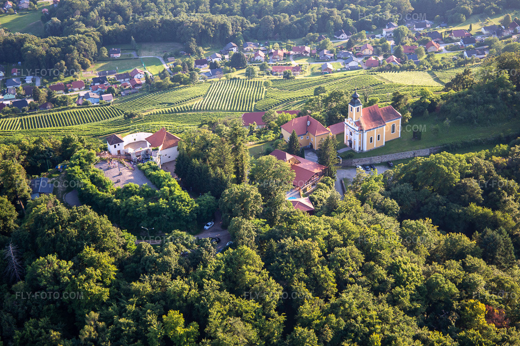 Aerial view: Church of Župnijska cerkev sv. Marije Vnebovzete and Café Huda Liza on the Vurberg in the district Vurberk in Duplek in the state Slovenia, Slovenia. – Photo: IMG_137354.jpg taken on 07/08/2023 by Werner Riehm/FLY-FOTO.com – Resolution of the original: 5472 x 3648 px