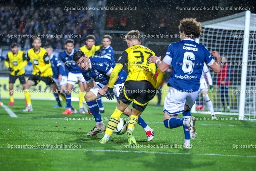 BVBII26012502182 | 26.01.2025, Fußball, 3.Liga, Borussia Dortmund II - Arminia Bielefeld, Stadion Rote Erde, Saison 2024 2025: Cole Campbell (BVBII #37) im Zweikampf gegen Mael Corboz (Arminia #6) und Stefano Russo (Arminia #21)DFB regulations prohibit any use of photographs as image sequences and or quasi-video.