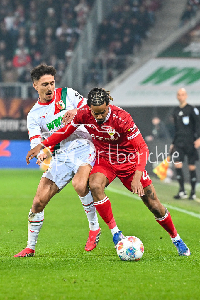 FC Augsburg - VfB Stuttgart | aUGSBURG, GERMANY - 22. MAERZ: im Duell Dimitrios GIANNOULIS (FC Augsburg 13) und Lorenz ASSIGNON (VfB Stuttgart 22) während dem Bundesligamatch zwischen dem FC Augsburg und dem VfB Stuttgart am 27. Spieltag in der WWK Arena / DFL REGULATIONS PROHIBIT ANY USE OF PHOTOGRAPHS AS IMAGE SEQUENCES AND/OR QUASI-VIDEO