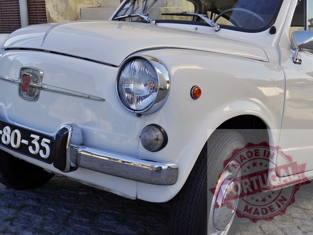 White Fiat 600 vintage classic European car | White Fiat 600 classic European vintage car parked on a cobblestone street - Realized with Pictrs.com