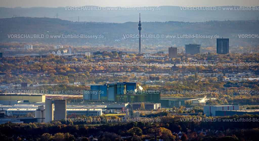 Dortmund231102107 | Luftbild, Skyline von Dortmund mit dunstiger Fernsicht und Rauchwolken, Blick vom Gewerbegebiet Westfalenhütte mit thyssenkrupp Steel Europe Anlage, Florianturm Aussichtsturm und Fernsehturm Wahrzeichen im Westfalenpark, Hochhäuser Firmensitz Westnetz und Bürotower Florian 11, umgeben von Herbstwald und herbstlichen Laubbäumen, Ruhrallee, Dortmund, Ruhrgebiet, Nordrhein-Westfalen, Deutschland
