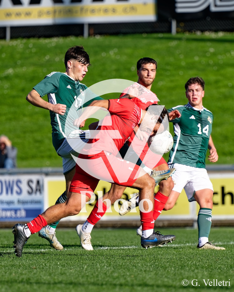 UEFA Region's Cup - NI Western Region v Vaud | John Butcher (17 NI Western Region) and Julien Beausire (9 Vaud) battle for the ball (duel) during the UEFA Region's Cup game between NI Western Region and Vaud at Centre Sportif de Colovray in Nyon, Switzerland 
